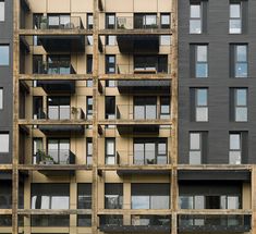 an apartment building with multiple balconies and windows