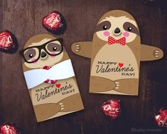 two valentine's day cards with slotty bears and chocolates in the background