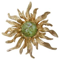 Vintage Boucher gold sun flower brooch with the most stunning green art glass center. This brooch is so beautifully designed with so many intricate details! The golden petals have the most gorgeous texture to them that really give this brooch a classic vintage touch. Pin this to a Gucci denim jacket over a green Missoni dress with some Prada sandals to complete the look! Signed Boucher circa 1960s. In pristine vintage condition with 0 signs of wear. Vintage jewelry is made to last a lifetime so Gucci Denim Jacket, 70s Shoot, Gucci Denim, Missoni Dress, Prada Sandals, Prada Jewelry, Gold Sun, Green Art, Flower Brooch