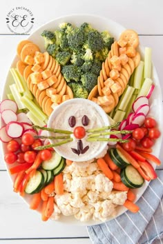 a white plate topped with vegetables and veggies