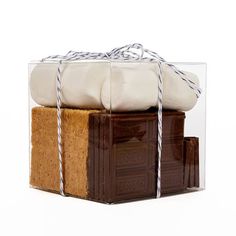 three pieces of soap in a clear box with twine and string tied around it