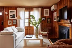 a living room filled with furniture and a fire place