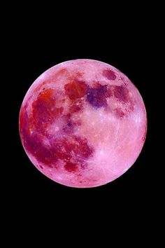 the full pink moon is shown against a black sky