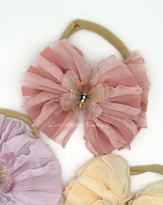 Add a touch of whimsy to your little one's look with our Butterfly Ruffled Bow on Nylon. This adorable headband features a ruffled messy texture and a cute butterfly center, perfect for adding a playful touch to any outfit. Plus, the nylon band ensures a comfortable and secure fit. Ruffle Ribbon Bow, Adjustable Pink Hat With Ruffles, Pageant Ooc, Ruffle Headband, Strawberry Outfit, Flower Girl Outfits, Baby Ruffle Romper, Baby Girl Ruffle Romper, Baby Head Wrap