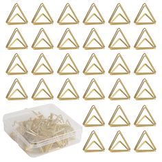 gold triangle shaped paper clips in a plastic container