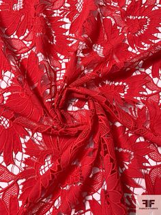 red lace fabric with flowers on it