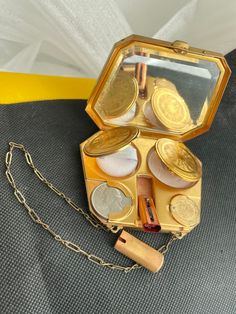 Gorgeous 1930 Compact Vintage Dance Purse Coin Holder Makeup Lipstick Chain Enamel Lady Gent Gift for Her Collectible Vanity This fine little 1930's MMR branded dance compact purse still retains a used face powder godet, used red lipstick in a fitted slider tube, spring-loaded coin holders, beveled glass mirror , two hinged interior doors, and a brand new tiny puff! Fabulous gift for any lady but especially the makeup/cosmetics/beauty and compact collectors out there! No dings or dings! Opens an Vintage Makeup Palette, Vintage Dior Makeup, Vintage Coin Purse, Retro Compact Coin Purse As Gift, Vintage Makeup Products, Creative Purse, 1930s Purse, Vintage Lipstick Holder, Compact Art