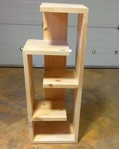 a wooden shelf sitting on top of a tiled floor