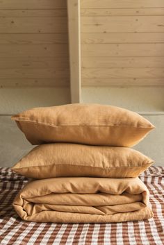 three pillows stacked on top of each other