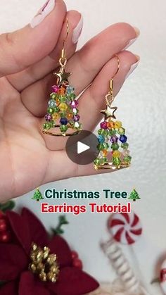 someone is holding their christmas tree earrings in their hand with the text, christmas tree earrings