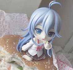 a close up of a figurine on a sandwich