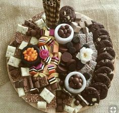 a platter filled with lots of different types of desserts