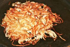 some food is being cooked in a pan on the stove top and ready to be eaten