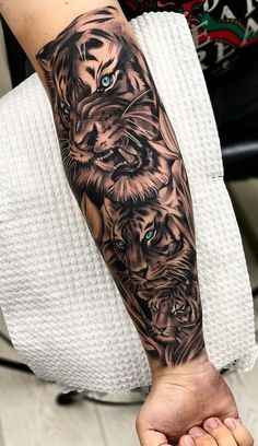 a person with a tiger tattoo on their arm