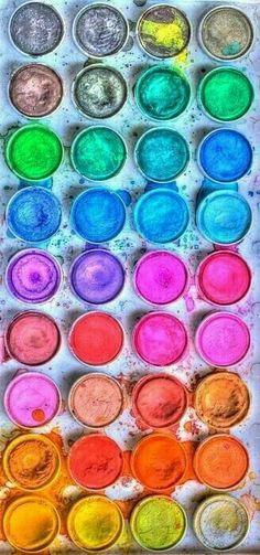 an open tray filled with lots of different colored paint