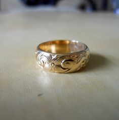 This band ring is handcrafted from 14k gold filled heavy pattern wire.The pattern makes it eye-catching. Unusual and fancy for a heavy weight band. It is a heavy band, 6.4mm wide and 1.7mm thick.This ring makes a great wedding band for either him or her. Couple it with my 4mm pattern ring to make a great wedding band set. http://www.etsy.com/listing/65984697/4mm-pattern-band-ring-14k-gold-filled---------------------------------DIMENSIONS: 6.4mm wide and 1.5mm thick.------------------------------ Posey Ring, Byzantine Gold, Gold Necklace For Men, Wide Wedding Bands, Pattern Ring, Wedding Band Sets, Engagement Rings For Men, Ring Finger, Crystal Rings