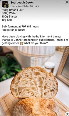 a loaf of bread sitting on top of a wooden cutting board