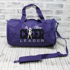 This personalized CHEER travel bag with black and silver applique on a custom bag color! This ready to hold all your stuff whether for after school practice, competitions or even a weekend at grandma's! Add a name for a super personalized on the go bag. With a design you won’t find anywhere else, Persunly duffle bags show off your favorite activity, while keeping all your gear handy and protected. Our three sizes are roomy and fit shoes, clothing, balls, and small sporting equipment. Made from a Personalized Bags For Everyday School Use, College School Spirit Bags For Back To School, Black School Spirit Bag For College, Back To School Spirit College Bags, Personalized School Spirit Bags, Customizable School Spirit Bags, Sporty Purple Bag For Back To School, Customizable School Spirit Bag For Everyday, Customizable School Spirit Bags For Everyday Use