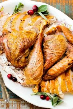 a white plate topped with turkey and cranberries