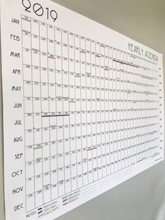 a large white calendar hanging on the wall