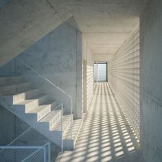 an empty room with stairs leading up to the door and light coming in through the window