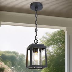 an outdoor light hanging from the ceiling