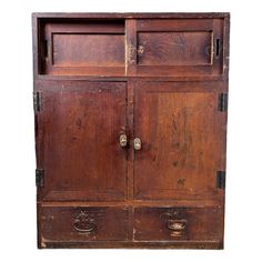 an old wooden cabinet with two doors on the front and one door open to reveal it's contents