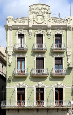 an old building with many balconies and windows