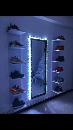 a lighted shoe rack in the corner of a room