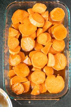 sliced sweet potatoes in a glass dish on a table