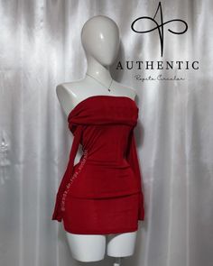 a mannequin with a red dress on display