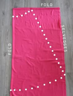 a pink blanket with white polka dots on it and measurements for the size of each piece