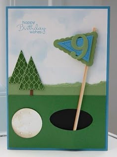 a birthday card with a golf ball and tee