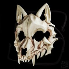 an animal skull mask is shown on a black background