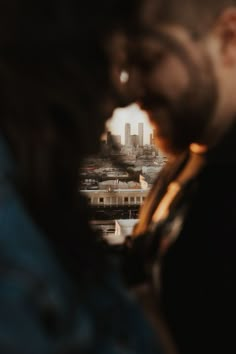 a man looking at the city through his glasses