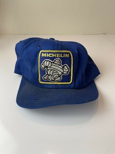 VINTAGE Michelin Man Patch Full Mesh Blue Snapback Cap USA Trucker Hat. Condition is "Pre-owned". Shipped with USPS First Class. The inside of this hat is starting to deteriorate Vintage One Size Fits Most Baseball Cap, Vintage Flat Cap Trucker Hat For Streetwear, Vintage Adjustable Baseball Cap, Vintage Baseball Cap, One Size Fits Most, Blue Retro Cap, Retro Blue Cap, Vintage Hat With Curved Bill, Retro Blue Baseball Cap With Curved Bill, Retro Blue 5-panel Hat