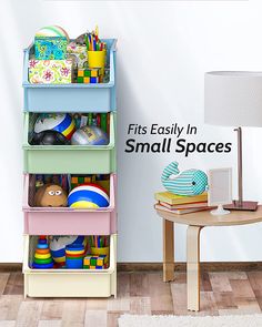 there is a toy storage rack next to a small table with toys on it and the words, fits easily in small spaces