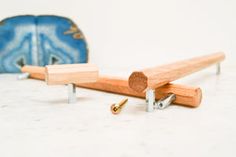 two pieces of wood sitting next to each other on top of a white countertop