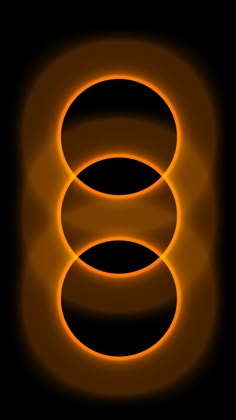 an orange ring on a black background with light coming from the top and below it