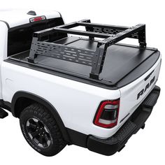 a white truck with a black bed rack on it's back and the tailgate open