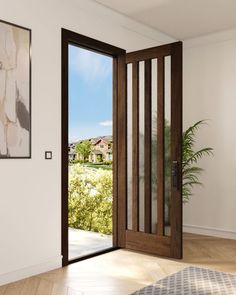 an open wooden door in a white room