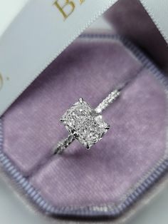 an engagement ring in a velvet box