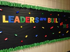 a bulletin board with the words leaders are built on it