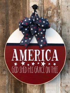 a patriotic sign with the words america god shed his grace on thee