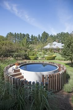 an advertisement for a swimming pool in the middle of a field with trees and bushes