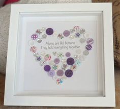 a white frame with buttons in the shape of a heart