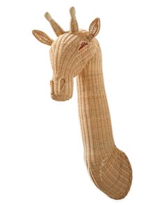 a wicker giraffe head on a white background