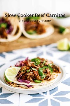 slow cooker beef carnitass on a tortilla