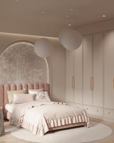 a bedroom with a large bed and white furniture