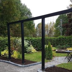 an outdoor garden area with tables and chairs